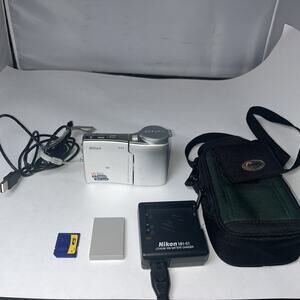 NIKON COOLPIX S10 VR Digital Camera, Case, New Battery -Charger, 1 GB Card WORKS